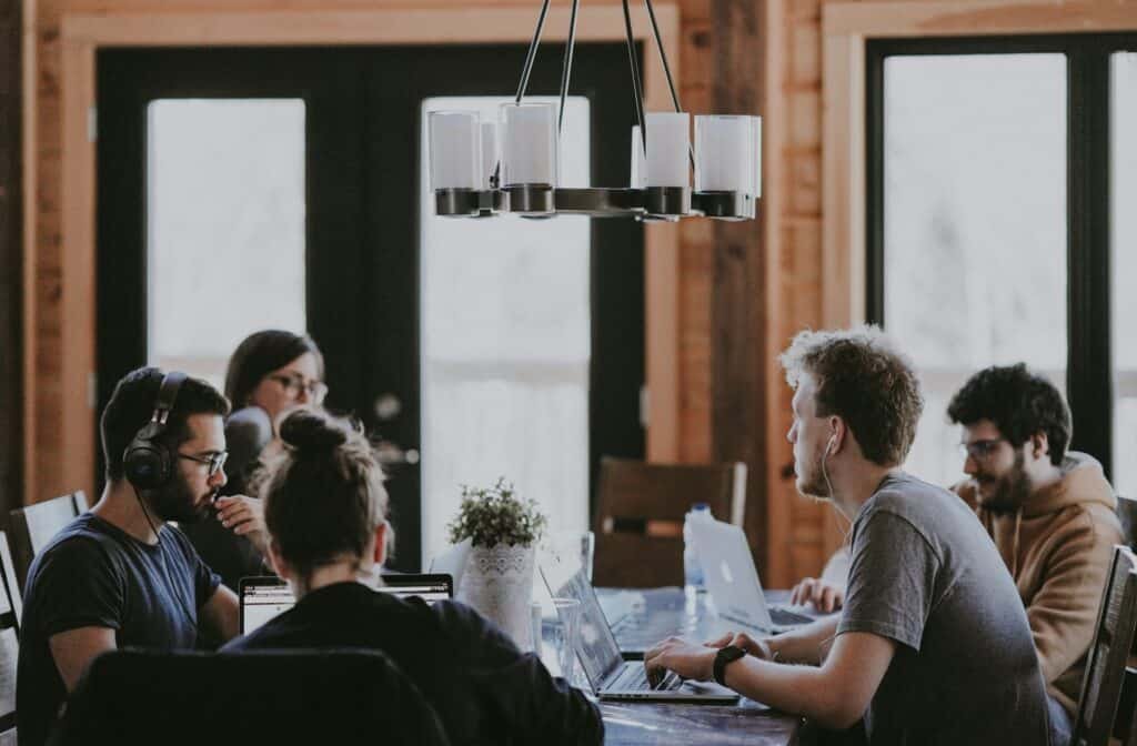 Group of people sitting at a table working together