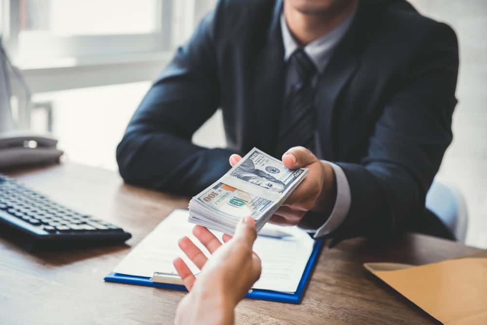 A man giving out fast personal loans