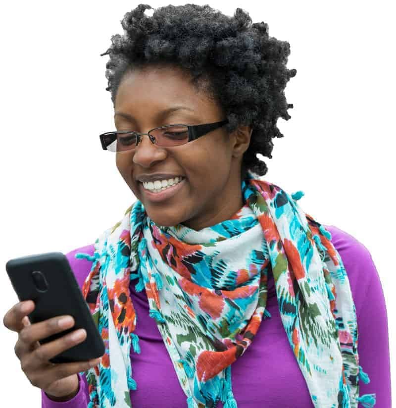 online-installment-loan-smile A smiling woman looking at her online installment loan approval on her phone.